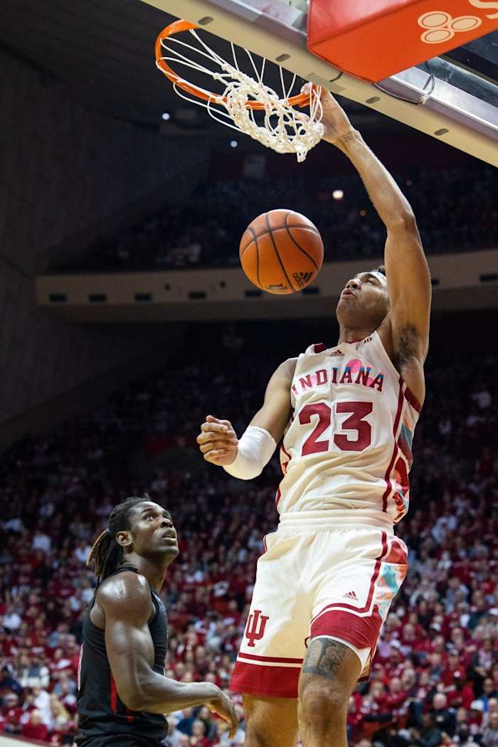 Trayce Jackson-Davis (23) shoots the ball while Rutgers Scarlet Knights forward Clifford Omoruyi (11) looks on.